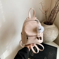 Chic light pink mini backpack in PU leather featuring a cute plush doll keychain charm - With Charm / Pink