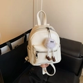 White faux leather mini backpack with plush eye charm for stylish women travel - With Charm / White