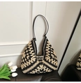 Detailed view of handmade woven pattern and leather strap on retro bohemian bag - Black