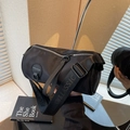 Black cylinder sporty crossbody bag with a wide letter-printed strap and logo detail - Black