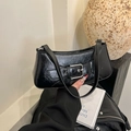 Chic black glossy leather baguette bag with a striking silver square buckle - Black