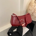 Minimalist burgundy baguette bag in glossy faux leather with silver buckle detail - Red