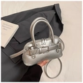 Detail of silver shell bag with metallic finish, double zippers, and buckle detail - Silver
