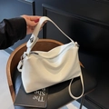 Chic pearl white glossy leather pillow bag with silver hardware and shoulder strap - Off-white