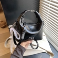 Glossy black crescent handbag with metallic ring handle and pearl lace ribbon - Black with Pendant