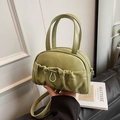 Light green pleated mini pillow bag with top handles and adjustable crossbody strap - Green