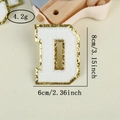 Detail of chenille letter D patch with white embroidery and golden sequins, 8cm height - Letter D / White / Hot Melt Adhesive