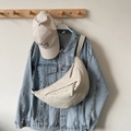 Chic beige crescent crossbody bag in durable nylon material for casual daily styling - Off-white