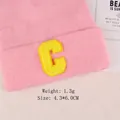 Pink knit beanie with yellow chenille letter C patch for DIY apparel decoration - Letter C Bright Yellow Display (GZ-4374)