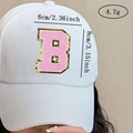 Detail of pink chenille letter B patch on white baseball cap with gold glitter border - Letter B / Pink / Hot Melt Adhesive