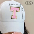 Pink chenille letter T patch with gold sequins on white cap measuring 6.5x8cm - Letter T / Pink / Hot Melt Adhesive