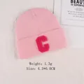 Pink knit hat featuring a fluffy chenille letter C patch with 4.3x6.0cm dimensions - Letter C Rose Red Display (GZ-4372)