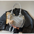 Silver shoulder bag with wave texture, gold hardware, and a plush bear charm detail - Silver (With Pendant)
