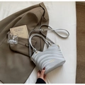 Silver-gray shoulder bag with 3D wavy texture and adjustable strap on neutral background - Silver No Pendant