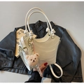 White bucket handbag with dual handles, adjustable strap and plush bear pendant detail - Cream White With Pendant
