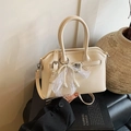 Elegant cream white crossbody bag with pearl bow and lace detail on a black book - Off-White (With Pendant)