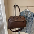 Dark brown PU leather travel bag with OFFBETTER logo and adjustable shoulder strap - Coffee