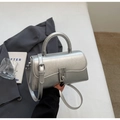 Detail of silver metallic wrinkled leather bucket bag with top handle and metal buckle - Silver No Pendant