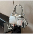 Close-up of metallic silver pillow bag with dual handles and rabbit graphic card slot - Silver