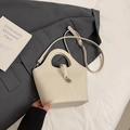 Elegant beige bucket bag in pebbled leather with silver lock and adjustable strap - No Pendant / Off White
