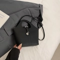Elegant black lychee leather bucket bag with silver lock and shoulder strap - No Pendant / Black