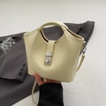 Minimalist cream bucket bag with silver buckle and circular handle for daily commuting - Light Yellow Without Charm