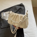 Chic beige pleated cloud bag with pearl chain handle and leather crossbody strap - White