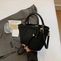 Mini black lychee leather bucket bag with gold hardware and a cute dog charm - Black
