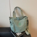Light green nylon tote bag with adjustable shoulder strap and elastic side pockets - Green