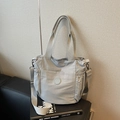Minimalist light grey nylon tote bag with wide shoulder strap and side pockets for commute - Gray
