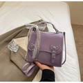 Detailed view of the purple PU leather bag with lace ribbon and 3D bow accents - Purple