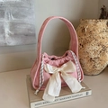 Pink corduroy handbag with large cream bow and drawstring detail for a chic look - Pink