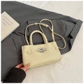 Chic cream white bucket bag in lychee texture leather with silver twist lock detail - No Pendant / Off White