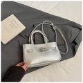 Elegant silver textured crossbody bucket bag with metallic finish and twist-lock closure - No Pendant / Silver