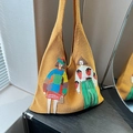 Chic vibrant yellow knitted tote bag featuring artistic cartoon embroidery design - Yellow