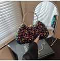 Macro view of colorful sequin evening bag with gold circular handle and chain - Style 1 Colorful