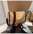 Detail of cream PU leather crossbody bag with brown strap and MAUDAI BEAR text logo - Off White