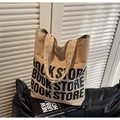 Detail view of the durable beige canvas tote bag with bookstore lettering print - Khaki
