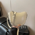 Chic off-white saddle shoulder bag with silver chain strap and polished faux leather - White