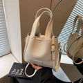 Creamy white litchi pattern leather bucket bag with dual handles and gold-tone hardware - Off White