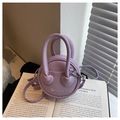 Detail of lavender litchi leather mini bag with heart decor and silver logo lettering - Purple