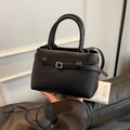 Elegant black lychee textured leather bucket bag with silver metal buckle detail - Black