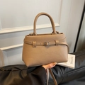 Light brown pebbled leather bucket bag with top handle and adjustable shoulder strap - Khaki