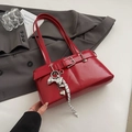 Red glossy patent leather shoulder bag with decorative buckle and chic charms - With Pendant / Red