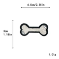 White bone-shaped embroidery patch with black edges and dimensions 6.5cm by 3cm - Bone (11056)