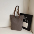 Minimalist deep brown canvas tote bag with leather handles and large front pocket - Gray
