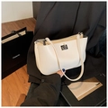 Detail of a minimalist cream white leather handbag with a silver square clasp and metal zipper - Off White