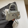 Mint green leather bucket bag with silver chain strap and metal clasp closure - Mint Green