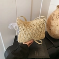 Handwoven straw shoulder bag with cat-ear silhouette and floral hollow patterns - With Charm / Beige
