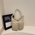 Beige canvas shoulder bag featuring dual front zipper pockets and adjustable straps - Off-white